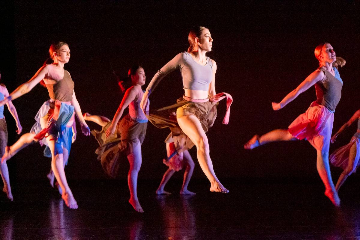 Girls leaping across the stage