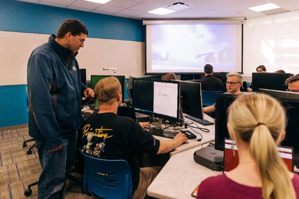 Snow College Software Engineering students working closely with professors.