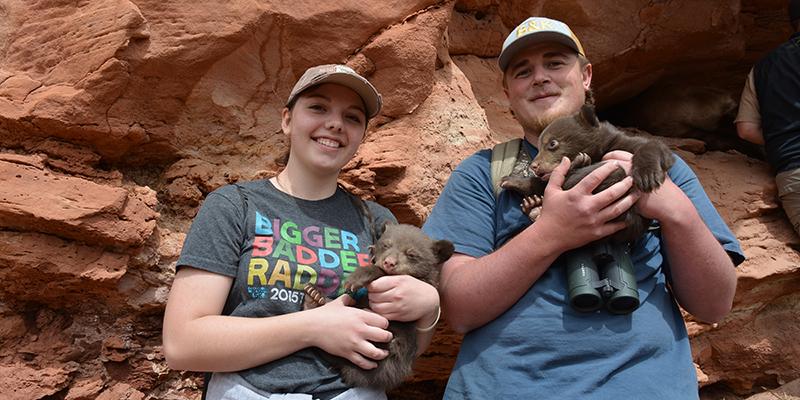 Students with bear cubs