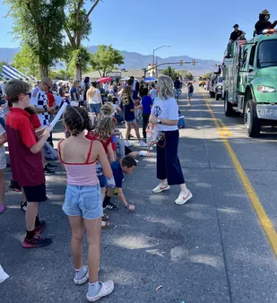 President Stacee McIff handing out parade treats